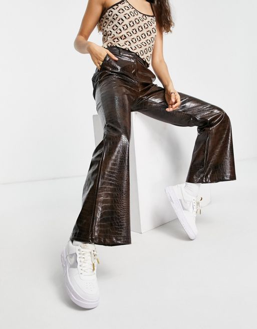 Topshop Petite faux leather flared trousers in black, ASOS