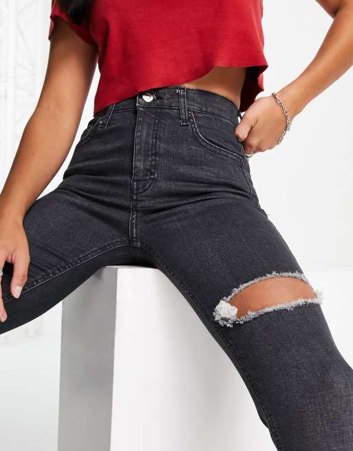 Topshop Petite Jamie jeans with thigh rip in washed black