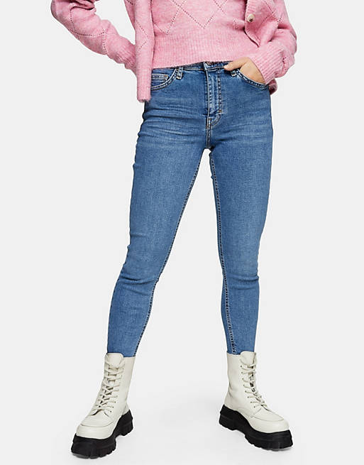 Topshop Petite Jamie jeans with abraded hem detailing in mid blue