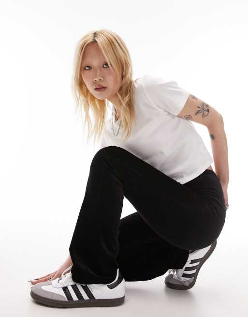 Topshop Petite - Pantaloni a zampa elasticizzati in velluto a coste neri