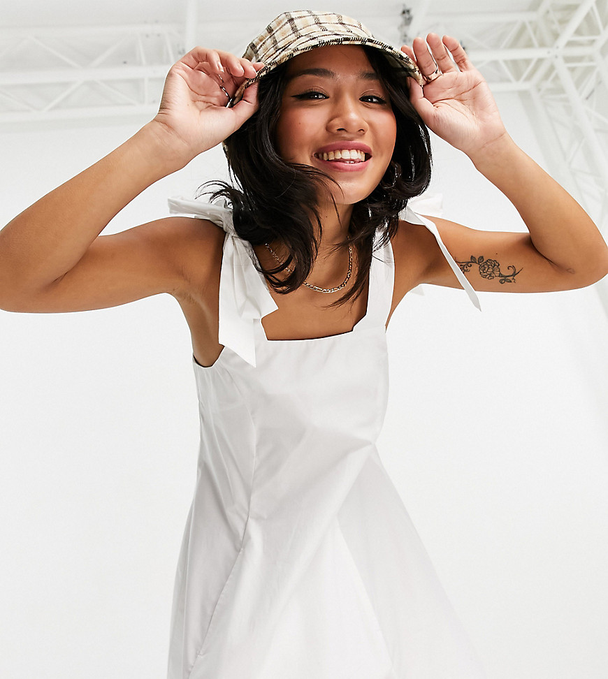 Topshop Petite poplin pinafore mini dress with bow detail in white