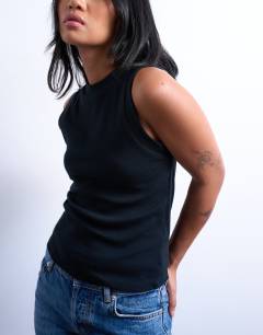 Model wearing Petite slim tank in black