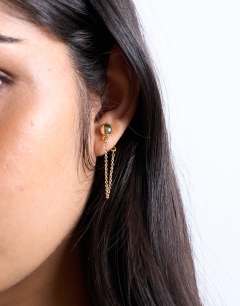 Model wearing Petra gold plated stud earring with chain in gold