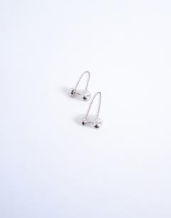 Model wearing Petra silver plated stud earing with chain in silver