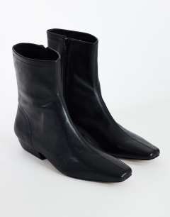 Model wearing Phoenix real leather chiselled ankle boot in black