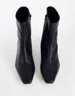 Model wearing Phoenix real leather chiselled ankle boot in black