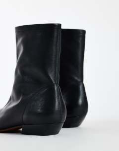 Model wearing Phoenix real leather chiselled ankle boot in black
