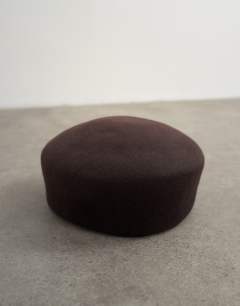 Model wearing Pillbox hat in chocolate