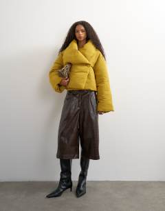 Model wearing Pillow puffer jacket in mustard