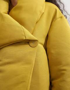 Model wearing Pillow puffer jacket in mustard