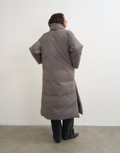 Model wearing Pillow removable scarf longline puffer jacket in taupe