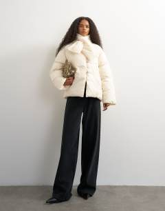 Model wearing Pillow removable scarf puffer jacket in ecru
