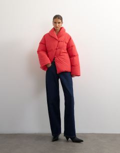Model wearing Pillow removable scarf puffer jacket in red