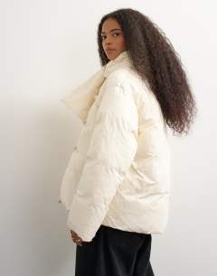 Model wearing Pillow scarf puffer jacket in ecru