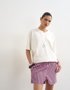 Model wearing Pink and purple stripe boxer short in pink