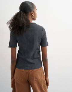 Model wearing Pink Floyd license shrunken half sleeve tee in washed black