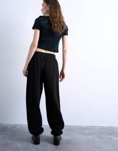Model wearing Pintuck cuffed jogger in black