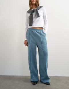 Model wearing Pintuck straight leg joggers in blue