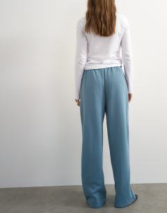 Model wearing Pintuck straight leg joggers in blue