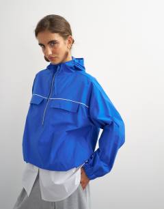 Model wearing Piping bomber in cobalt