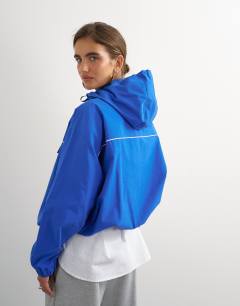 Model wearing Piping bomber in cobalt
