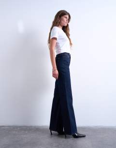 Model wearing Pippa mid rise comfort stretch flare jean in indigo rinse