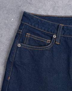 Model wearing Pippa mid rise comfort stretch flare jean in indigo rinse