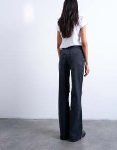 Model wearing Pippa mid rise comfort stretch flare jean in washed black