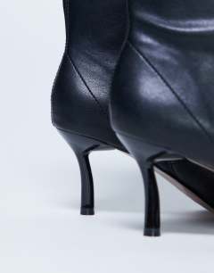 Model wearing Pippa point toe stretch ankle boot in black