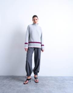 Model wearing Placement stripe jumper in grey