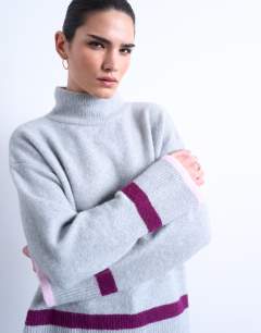 Model wearing Placement stripe jumper in grey