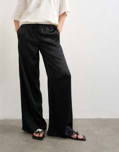 Model wearing Plain satin tie waist wide leg trouser in black