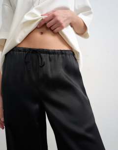 Model wearing Plain satin tie waist wide leg trouser in black