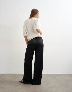 Model wearing Plain satin tie waist wide leg trouser in black