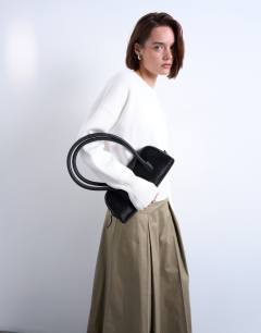 Model wearing Pleat front midi skirt in stone