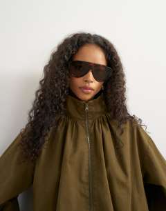 Model wearing Pleated funnel neck anorak in khaki