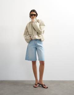 Model wearing Pleated funnel neck anorak in stone