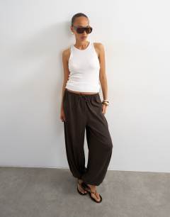 Model wearing Plisse balloon trouser in chocolate