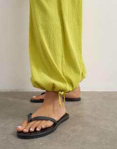 Model wearing Plisse balloon trouser in green