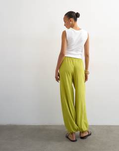 Model wearing Plisse balloon trouser in green