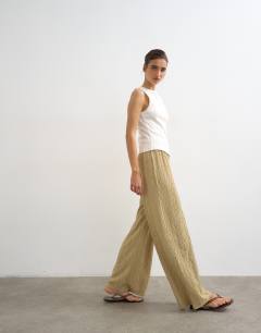 Model wearing Plisse jersey wide leg trouser in khaki