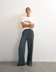 Model wearing Plisse jersey wide leg trouser in slate