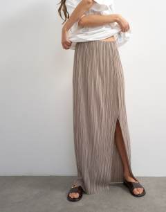Model wearing Plisse maxi skirt in oat
