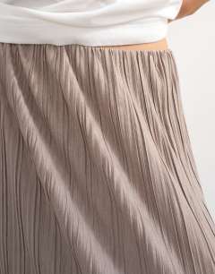 Model wearing Plisse maxi skirt in oat