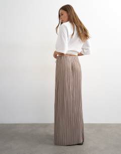 Model wearing Plisse maxi skirt in oat