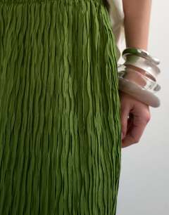 Model wearing Plisse straight leg trouser in green