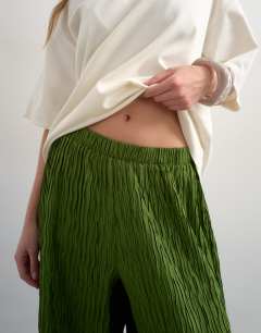 Model wearing Plisse straight leg trouser in green