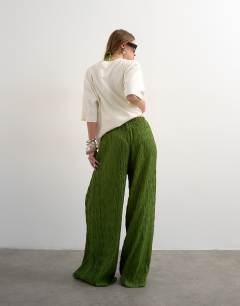 Model wearing Plisse straight leg trouser in green