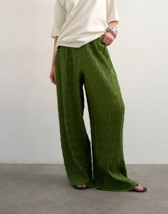 Model wearing Plisse wide leg trouser in green