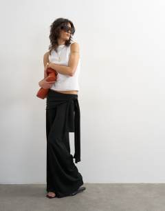Model wearing Plisse wrap scarf detail trousers in black